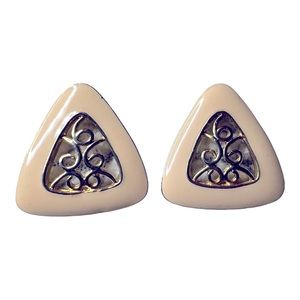 Vintage earrings with light pink enamel and gold centre.